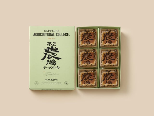 薄緑色の「第2農場チーズケーキ」の箱と、6個の個包装を並べた6個入の商品写真